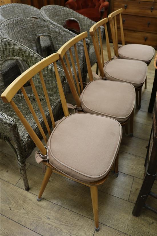 Four Ercol dining chairs (design no.391) with cushions